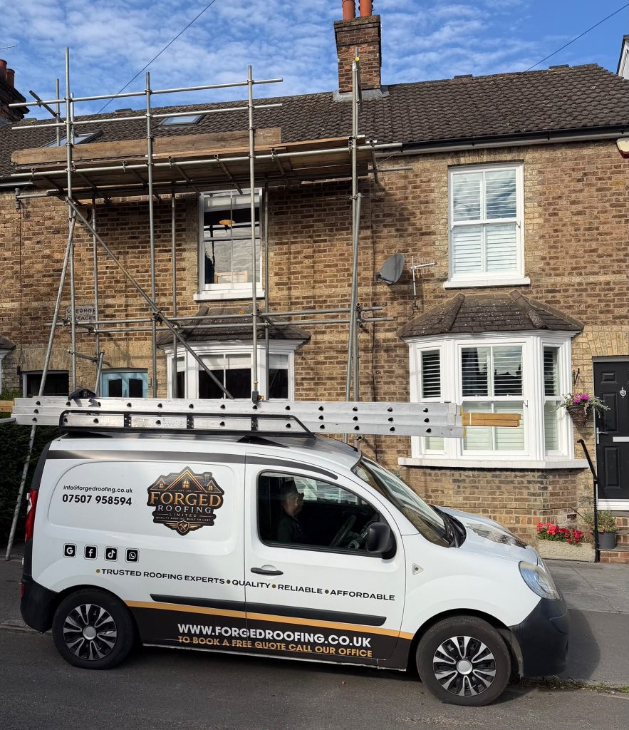 forged roofing van outside a job